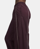 Pantalone Donna Under Armour Unstoppable Woven Wind Bordeaux | NonSoloSport